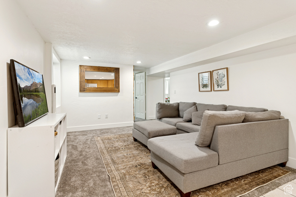 Living room featuring recessed lighting and carpet