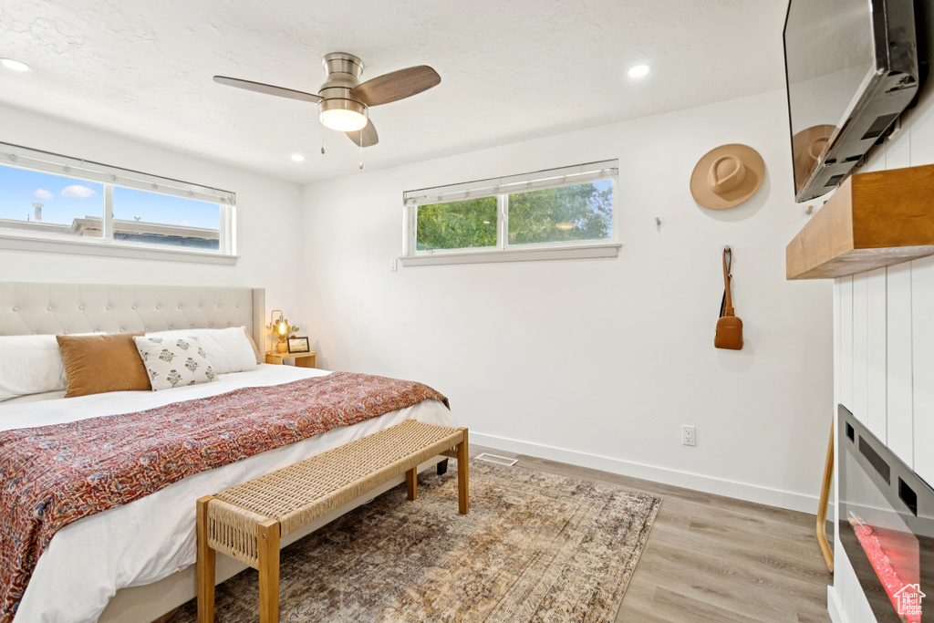 Bedroom featuring light wood-type flooring, recessed lighting, and a ceiling fan