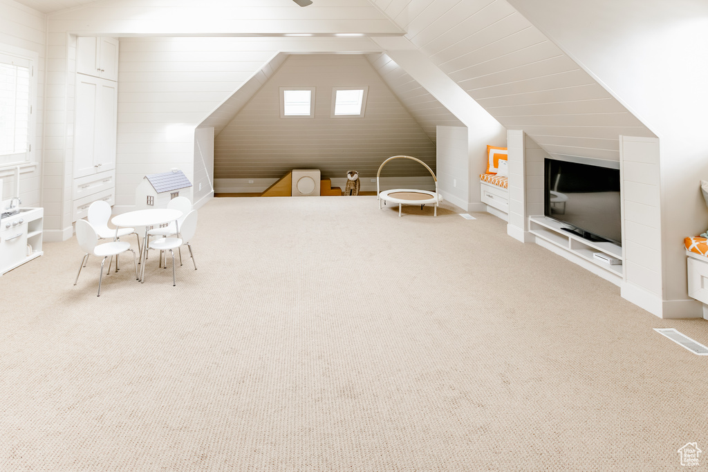 Game room featuring carpet floors and vaulted ceiling