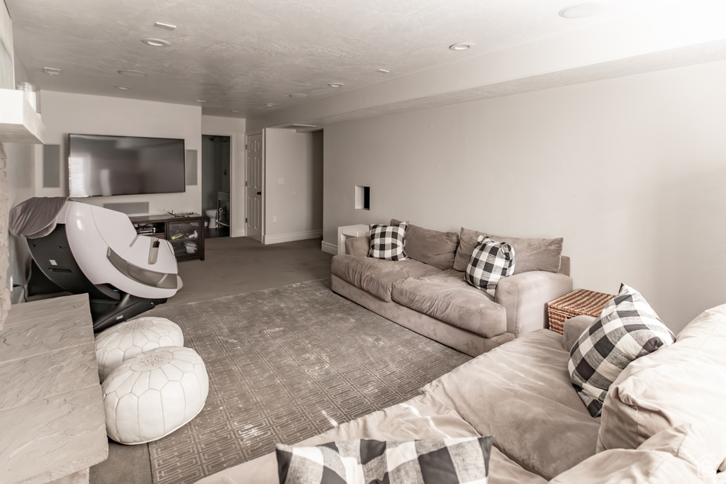 Carpeted living room with recessed lighting