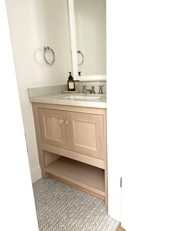 Bathroom featuring vanity and tile patterned flooring