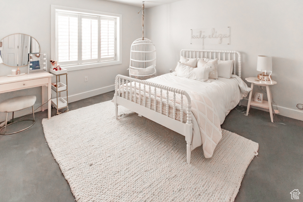 Bedroom featuring baseboards and an office area