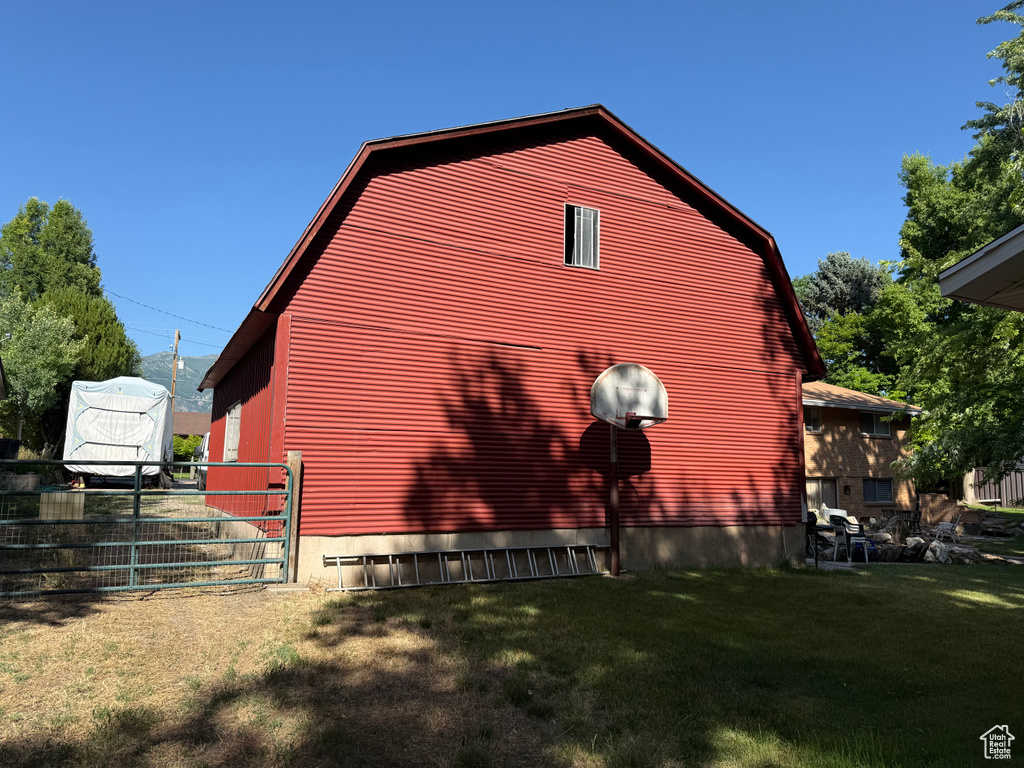 View of home's exterior with a gambrel roof