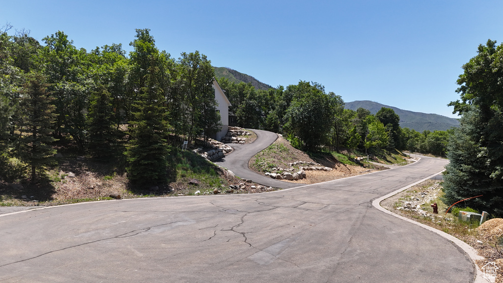 View of asphalt street with a mountain view