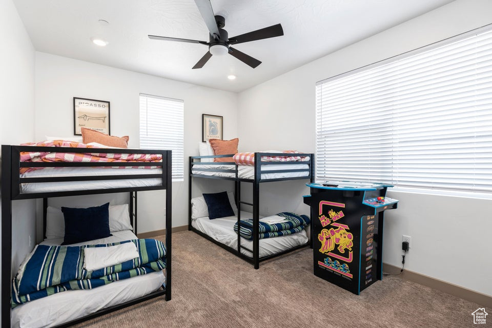 Bedroom with carpet flooring, a ceiling fan, and recessed lighting