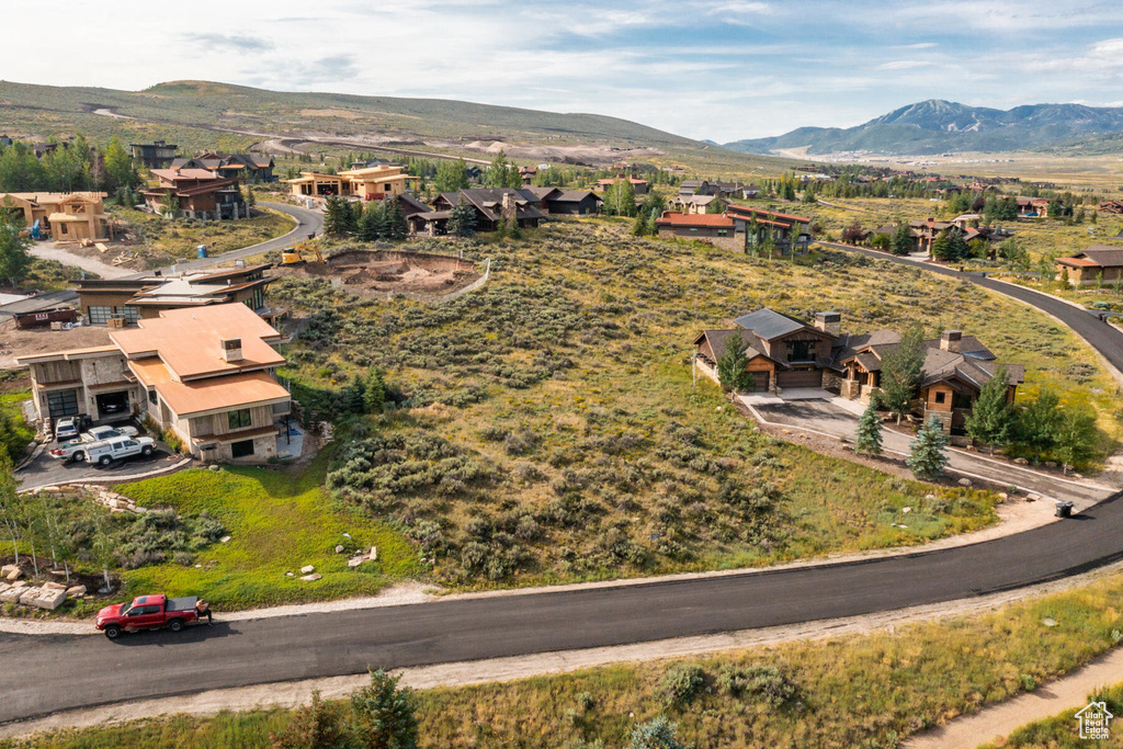 Aerial view of residential area featuring a mountain backdrop