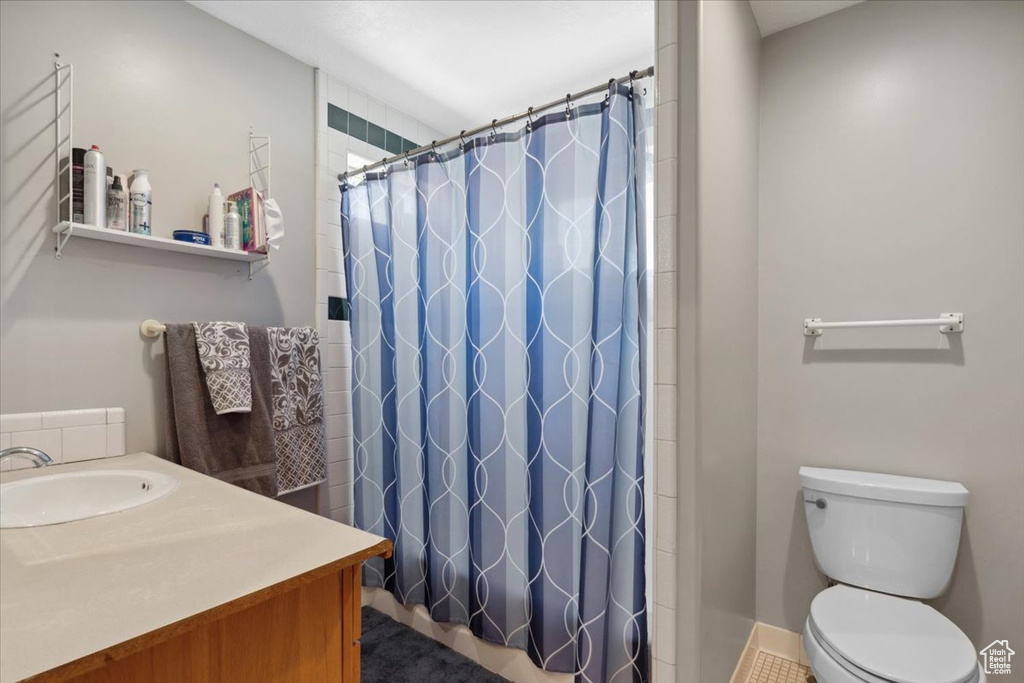 Bathroom featuring vanity and a shower with curtain