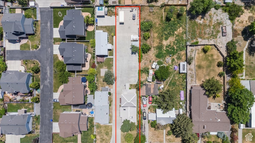 Aerial view of residential area with property parcel outlined