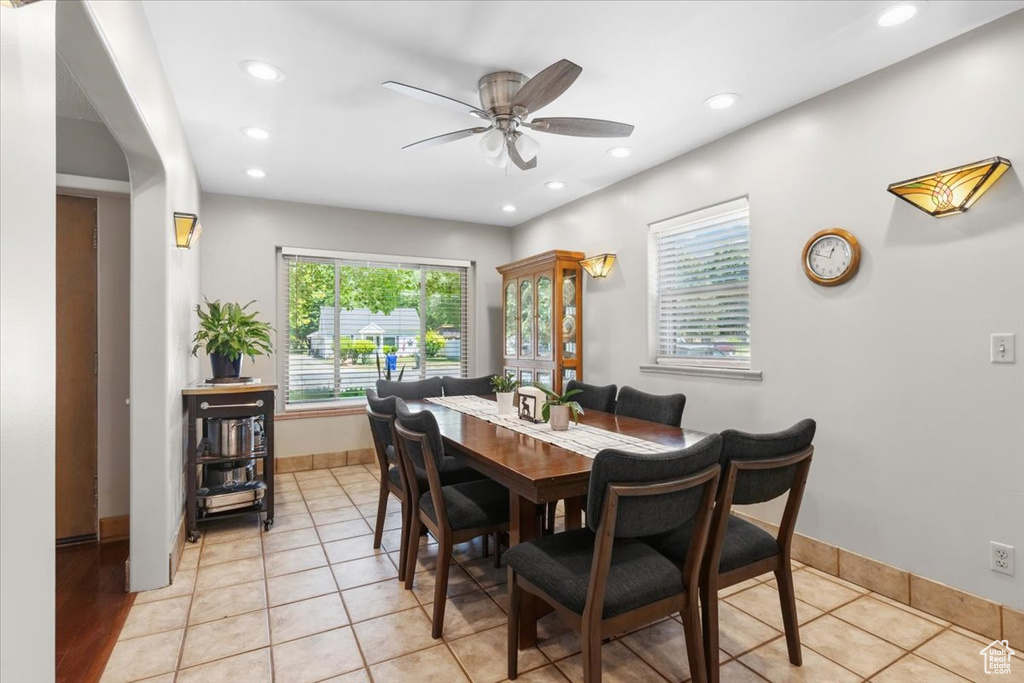 Dining room with a ceiling fan, recessed lighting, and light tile patterned floors