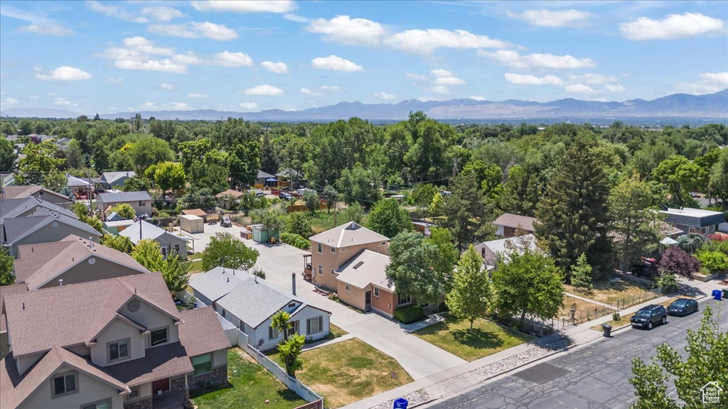 Aerial perspective of suburban area with a mountainous background