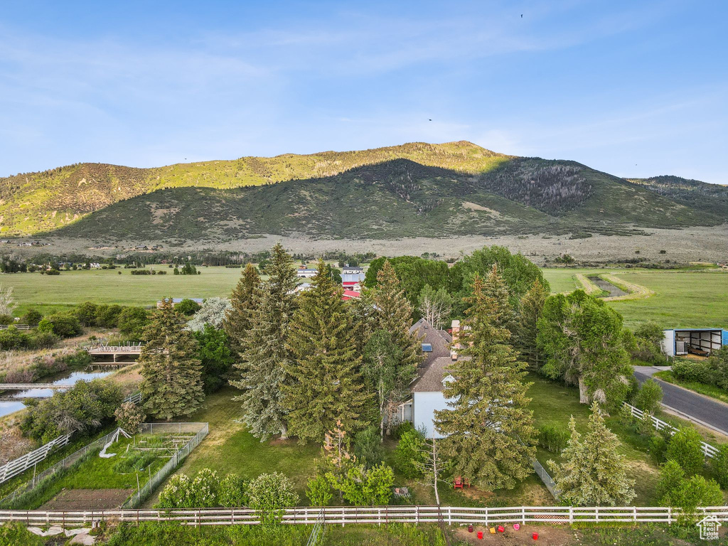 View of mountain backdrop featuring rural landscape