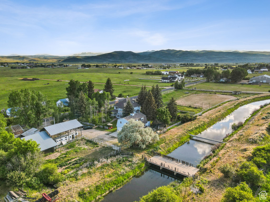 Aerial view of sparsely populated area featuring a water and mountain view