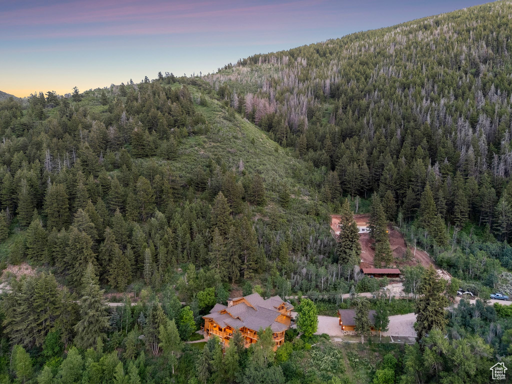 View of property location featuring a heavily wooded area
