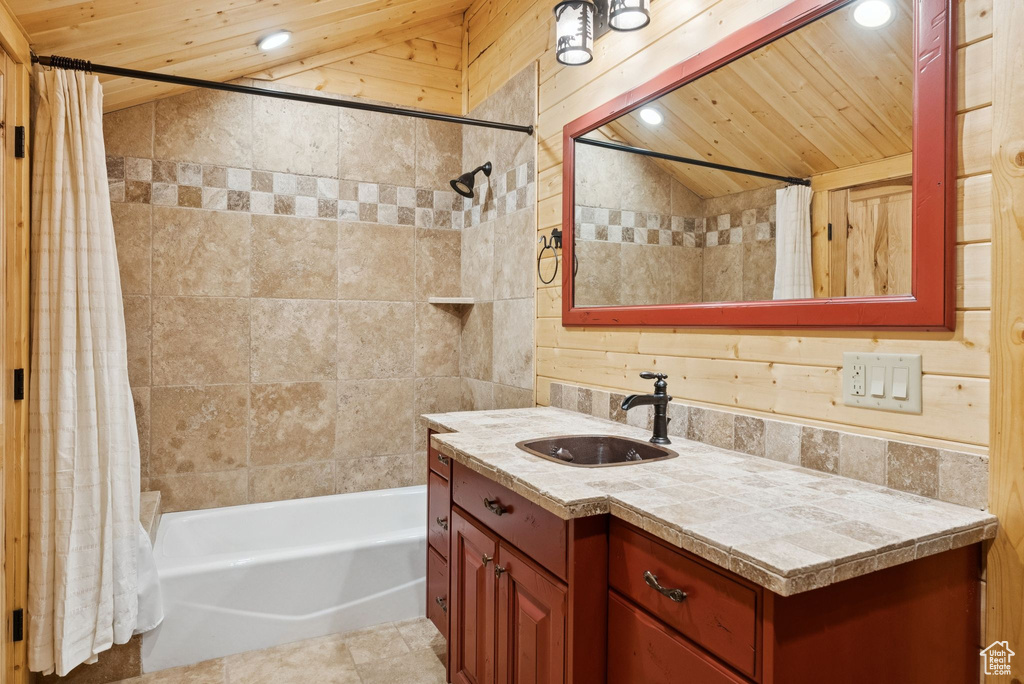 Bathroom with vaulted ceiling, wood ceiling, vanity, recessed lighting, and shower / bath combination with curtain