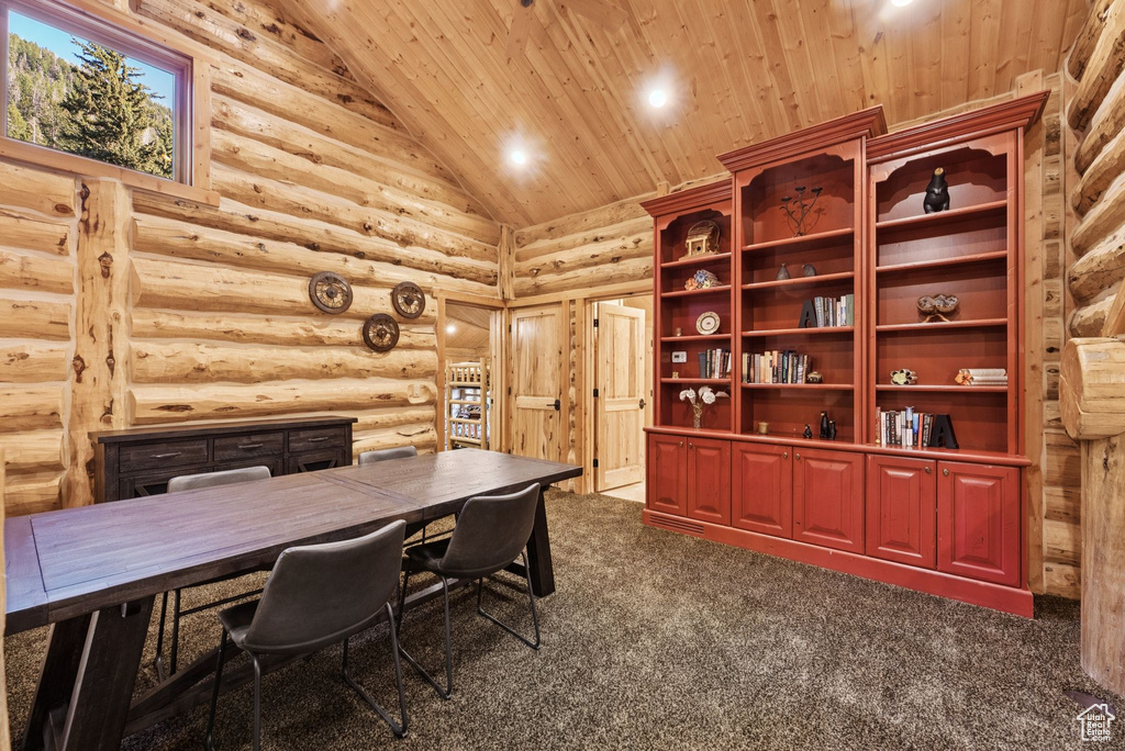Home office featuring wood ceiling, high vaulted ceiling, dark colored carpet, rustic walls, and recessed lighting
