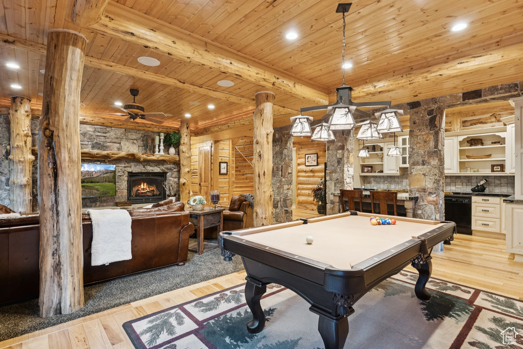 Playroom with a ceiling fan, a fireplace, a wooden ceiling with exposed beams, billiards, and light wood-type flooring