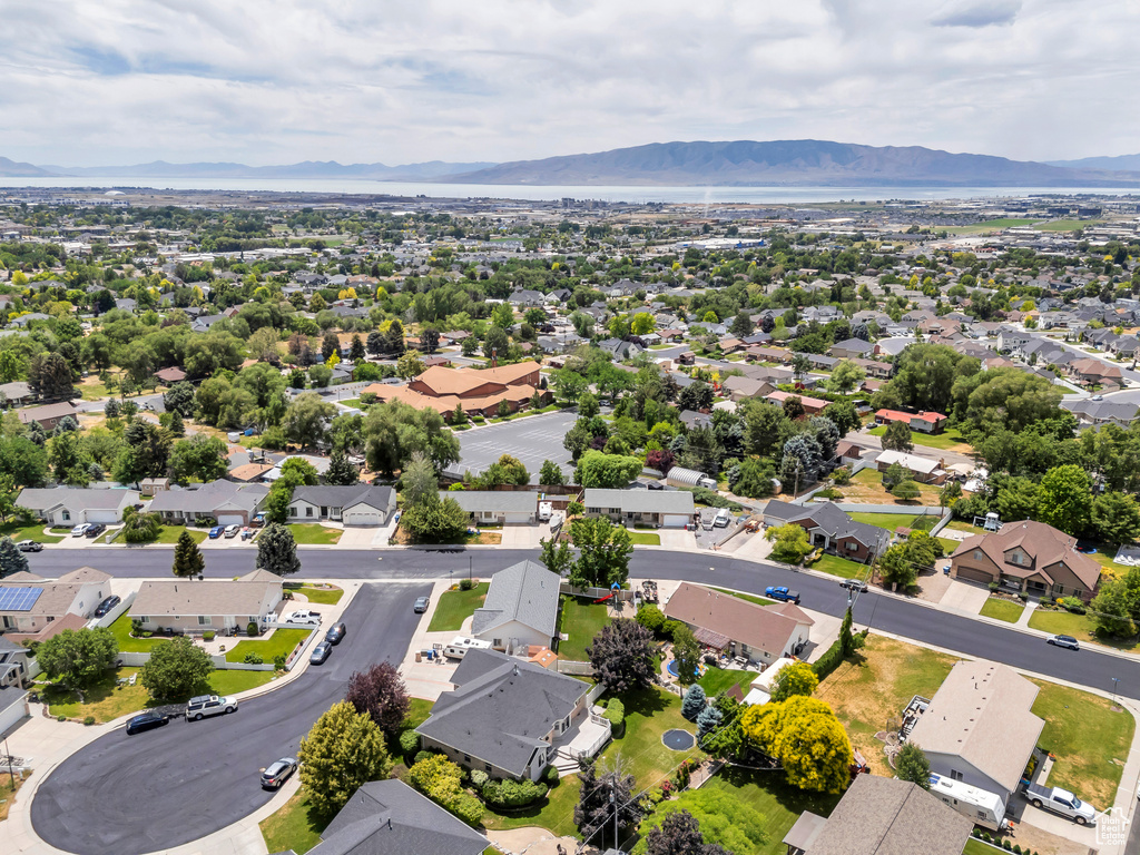 Aerial perspective of suburban area with a mountainous background