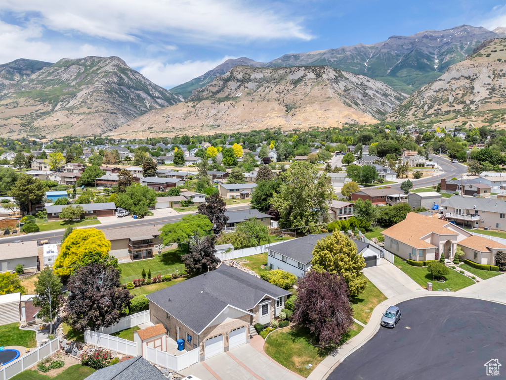 Aerial view of residential area featuring mountains