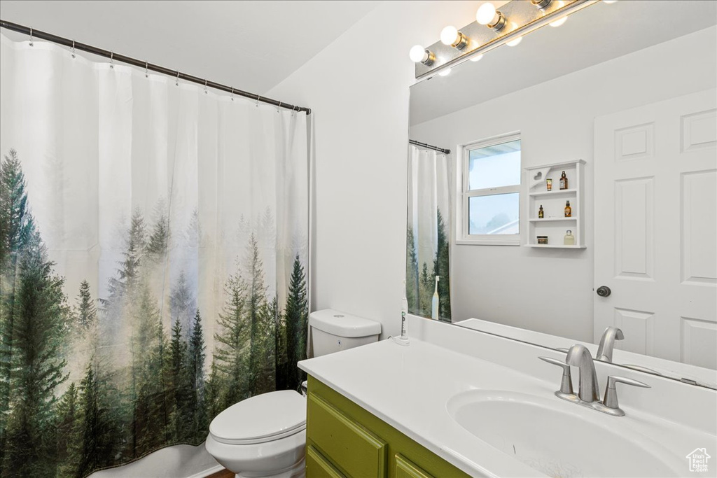 Full bathroom with vanity and a shower with curtain