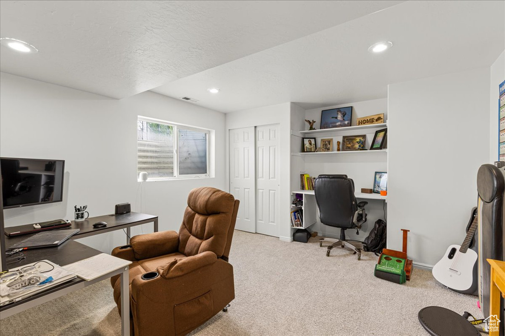 Office with carpet floors, recessed lighting, and a textured ceiling