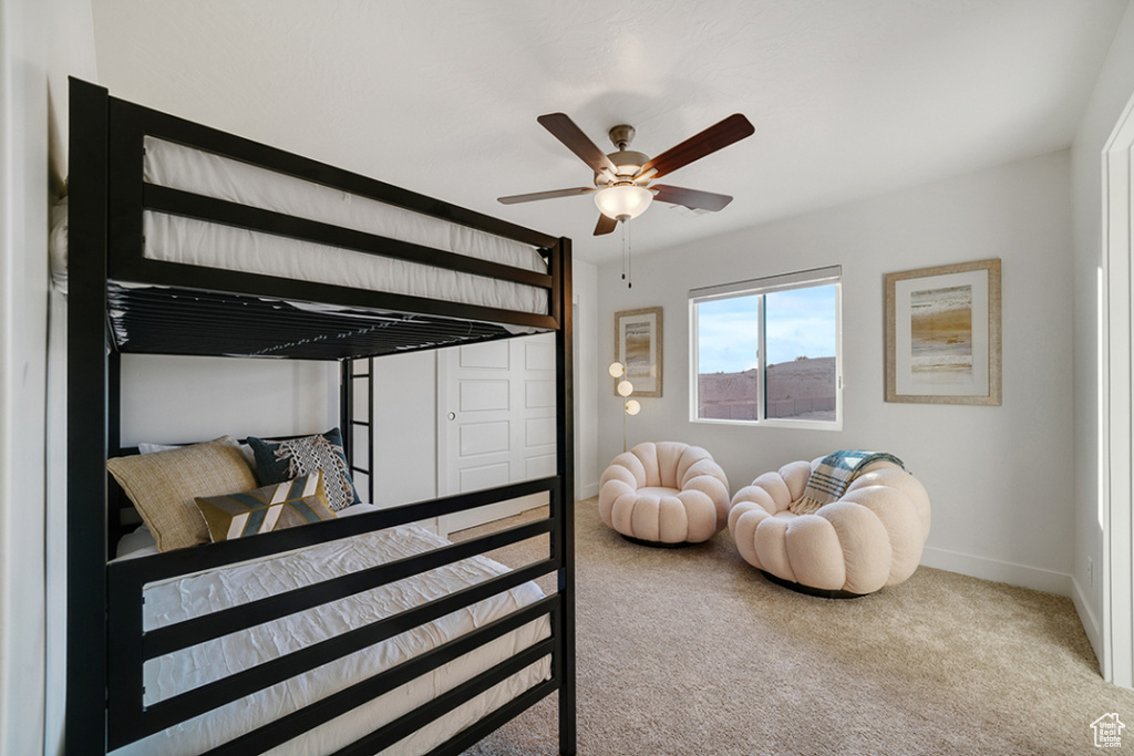 Bedroom featuring carpet floors and a ceiling fan