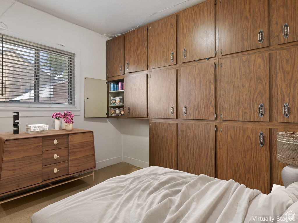 Bedroom featuring baseboards
