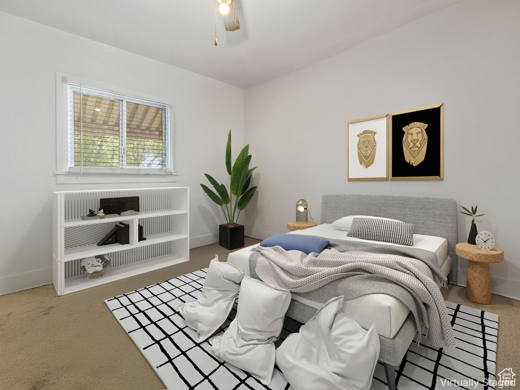 Bedroom with carpet floors and a ceiling fan
