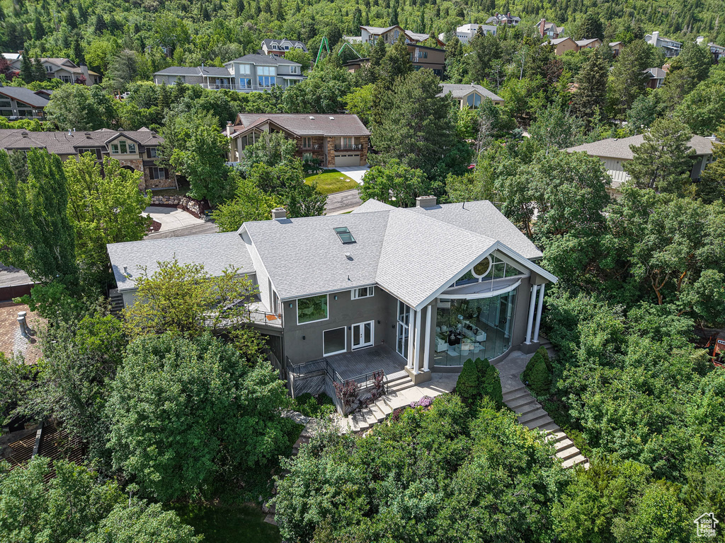 Aerial perspective of suburban area with a heavily wooded area