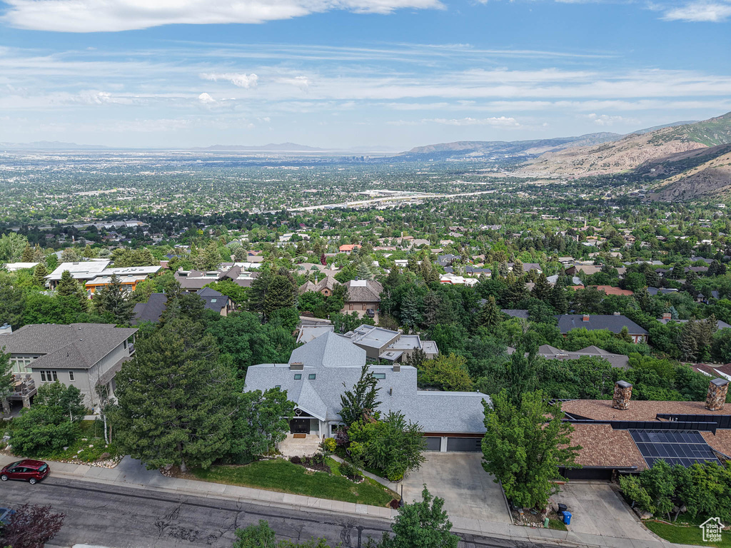 Aerial perspective of suburban area featuring a mountain backdrop