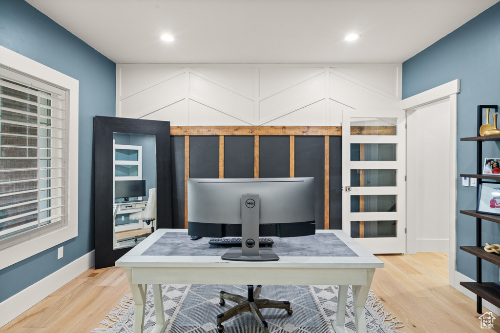 Office space featuring wood finished floors and recessed lighting