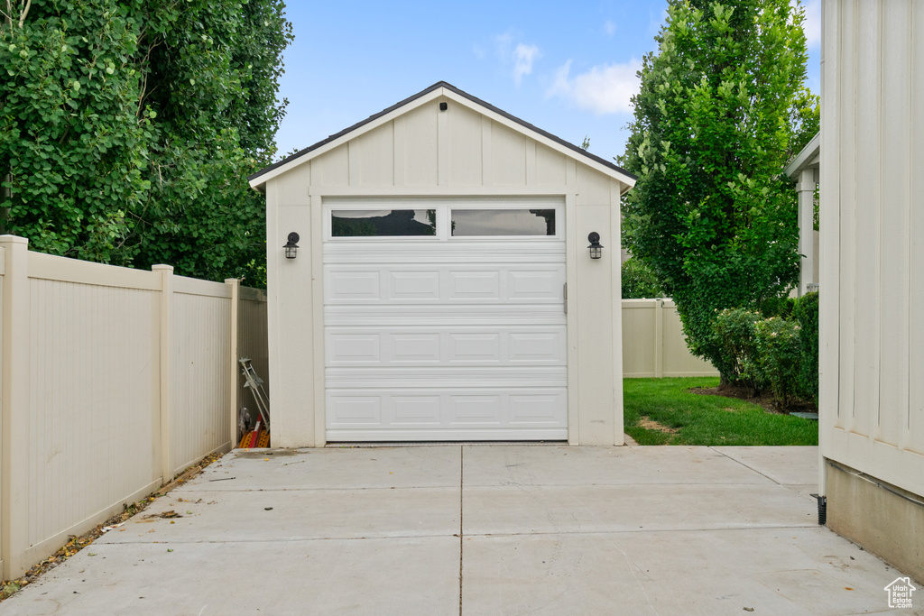Garage featuring driveway