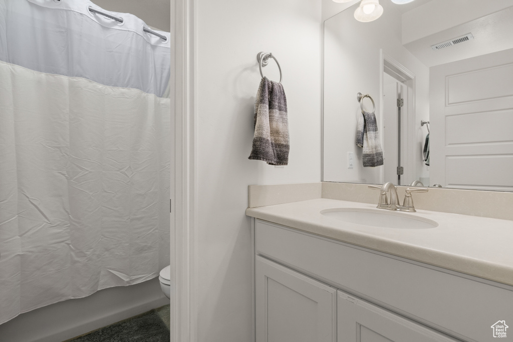 Bathroom with vanity and toilet