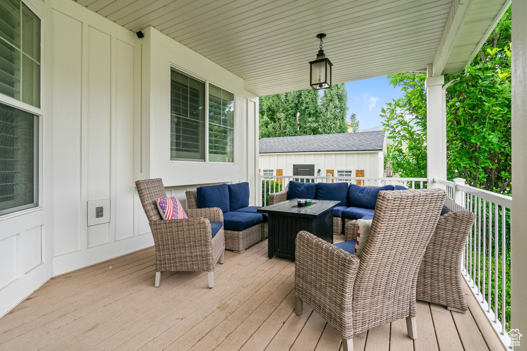 Wooden deck featuring an outdoor hangout area