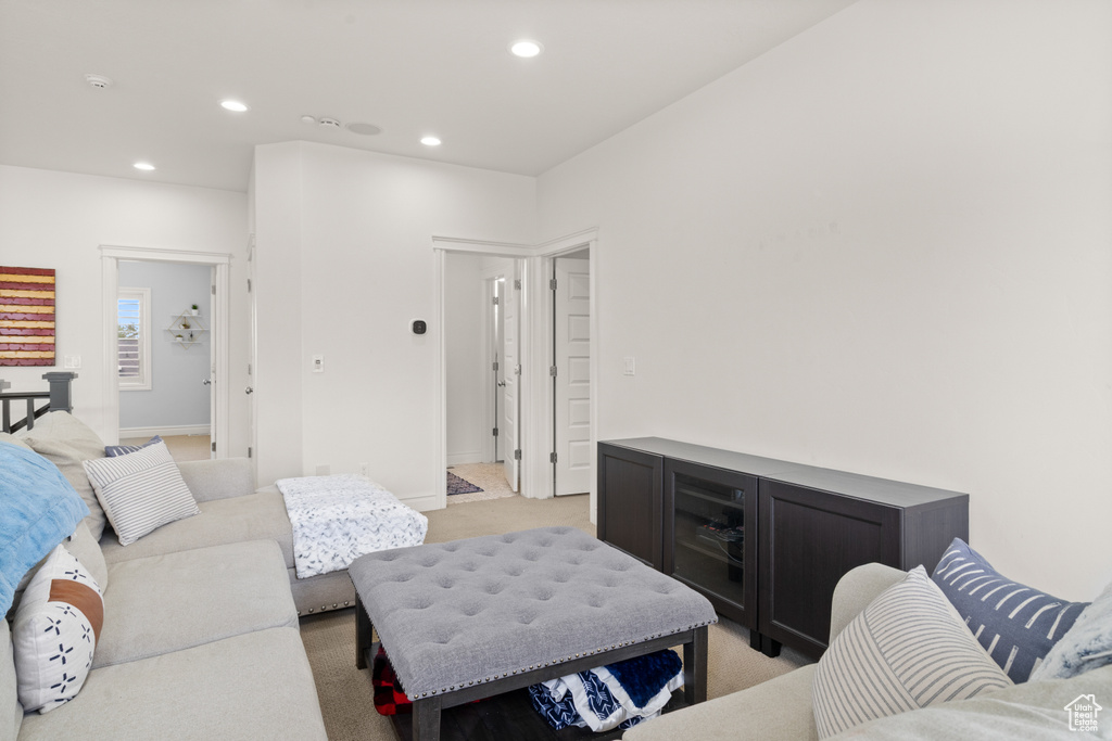 Living room featuring recessed lighting and light colored carpet