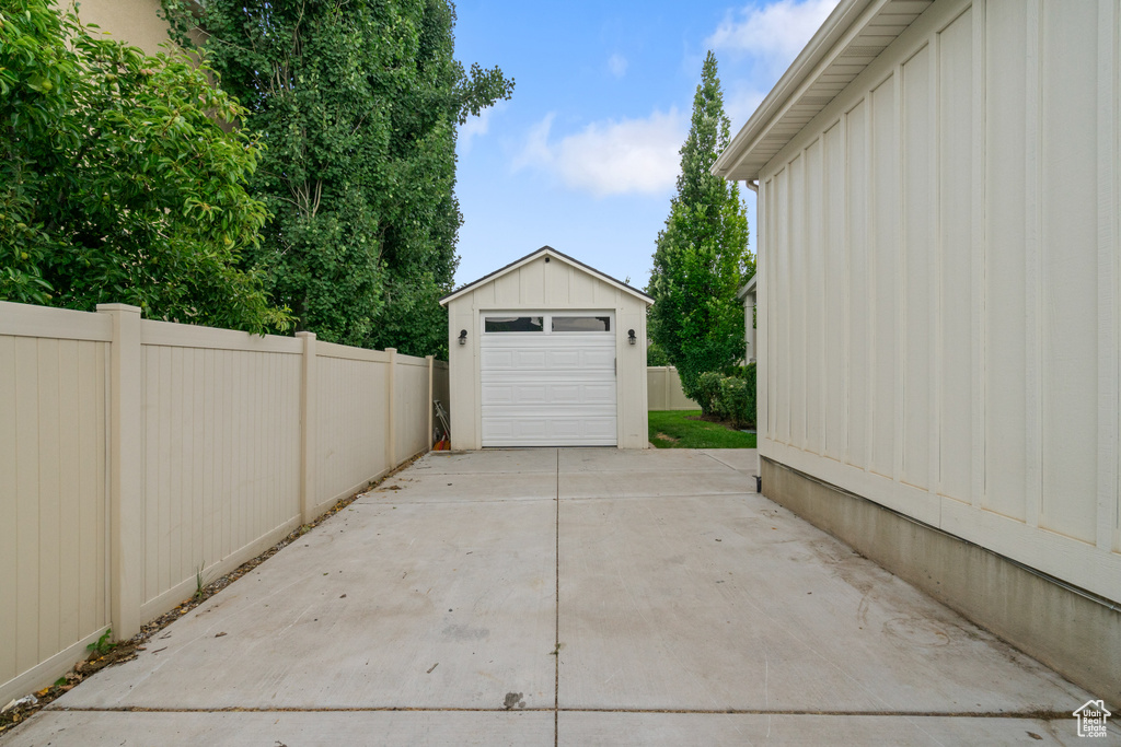 Detached garage featuring driveway