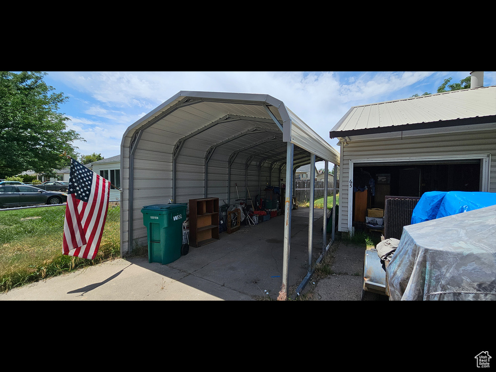 View of vehicle parking with a detached carport
