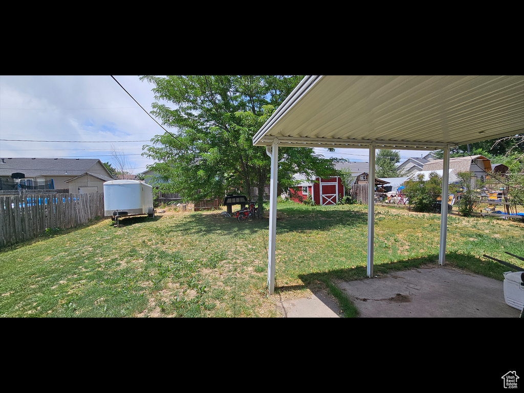 Fenced backyard with a shed