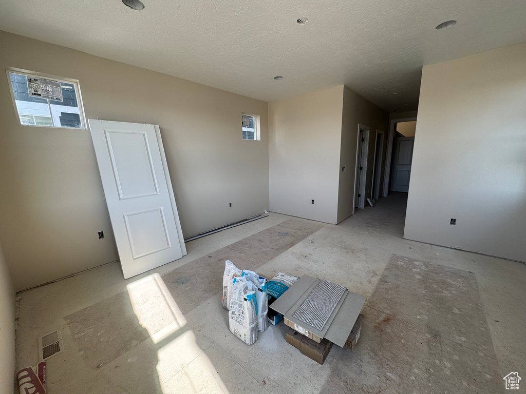 Spare room featuring a textured ceiling