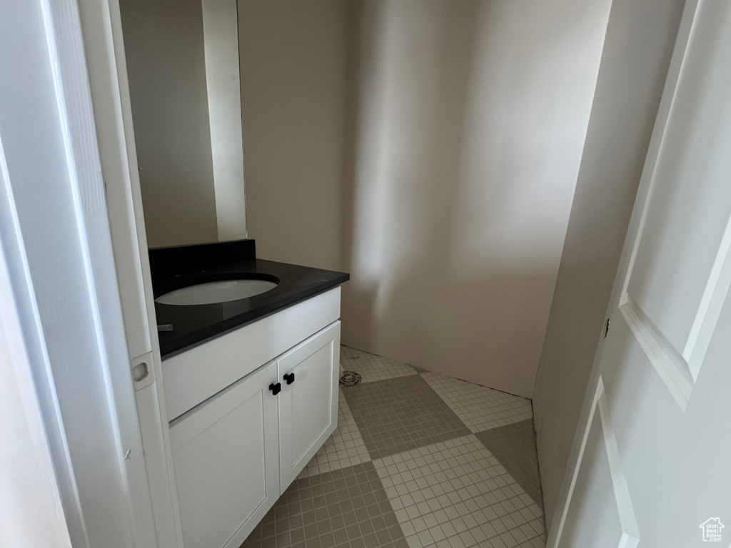 Bathroom featuring vanity and tile patterned floors