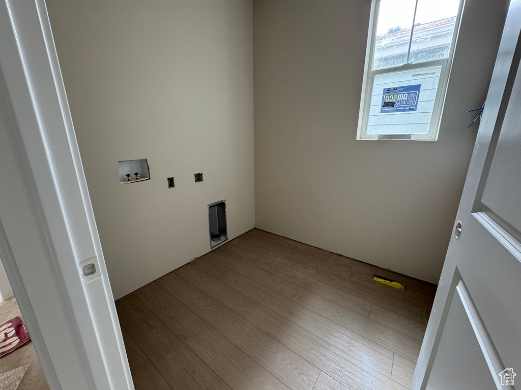 Laundry room featuring hookup for a washing machine and wood finished floors