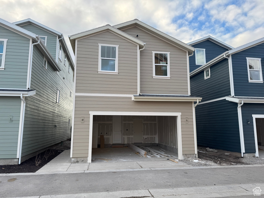 View of front of property featuring a garage