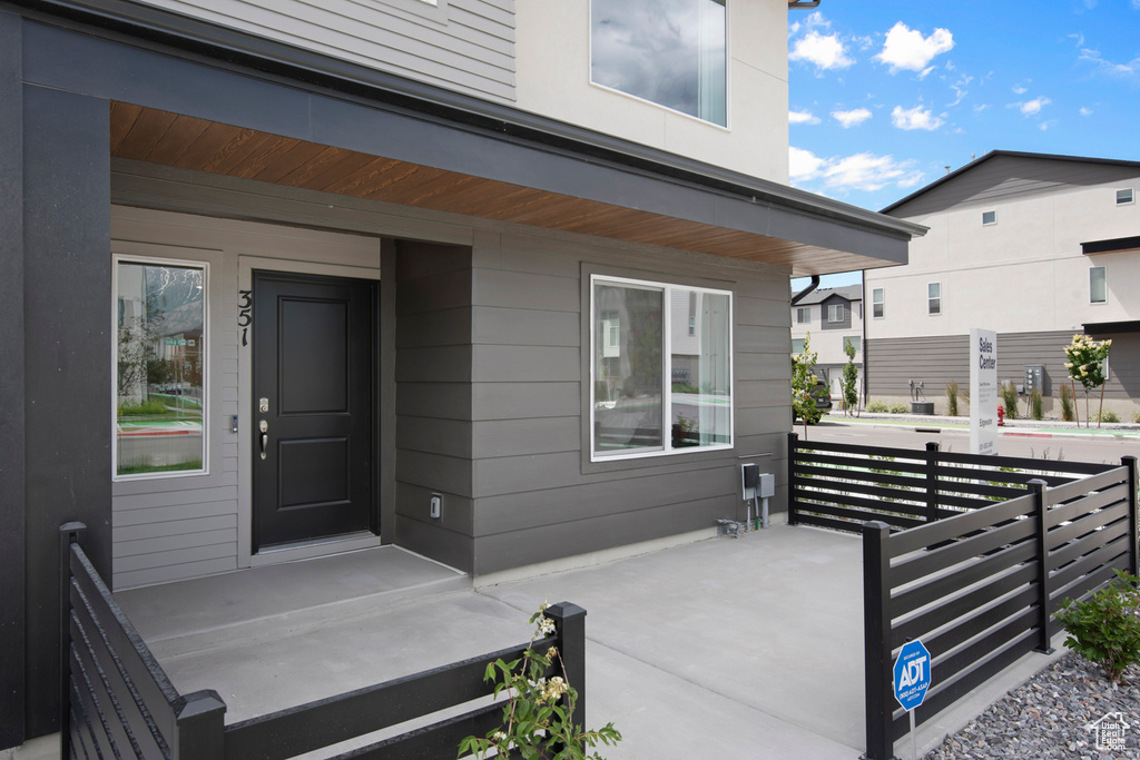 Property entrance featuring covered porch