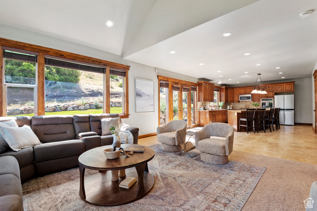 Living area with recessed lighting, healthy amount of natural light, and light tile patterned flooring