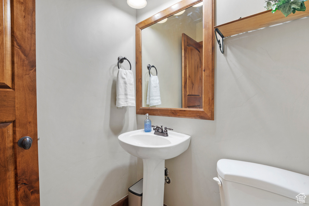 Half bath featuring toilet