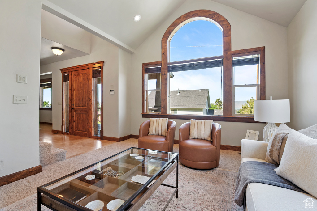 Living area featuring vaulted ceiling