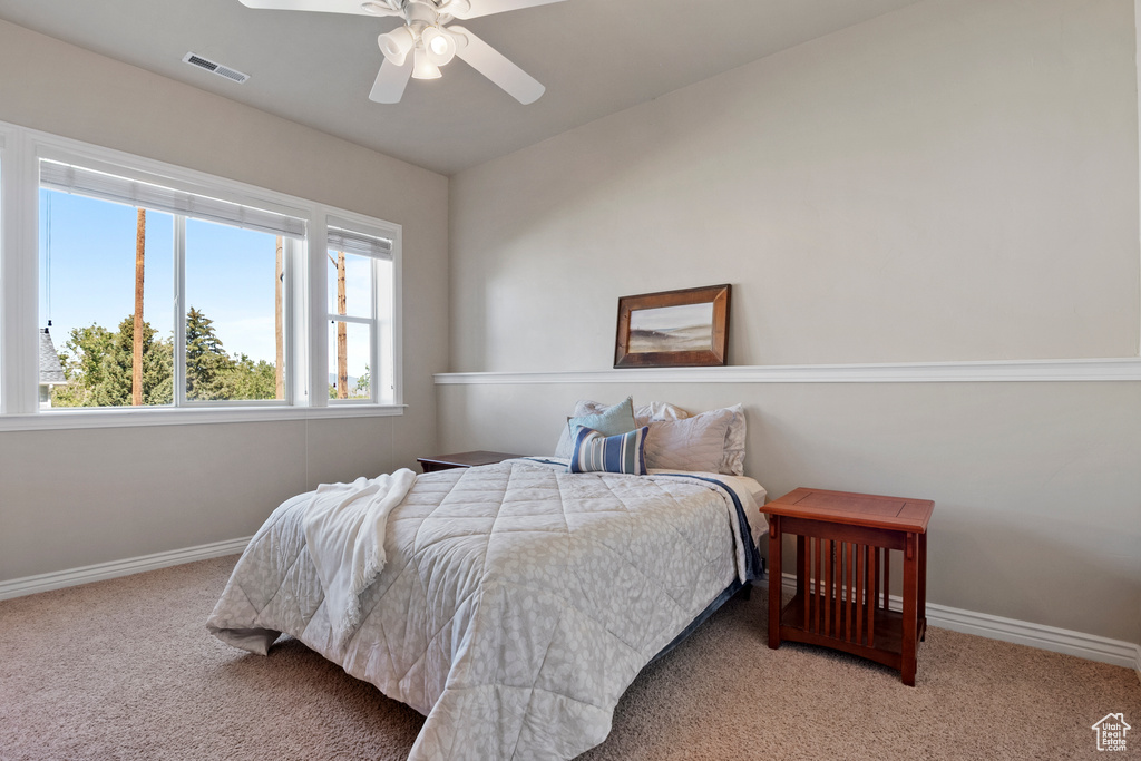 Bedroom featuring carpet flooring and ceiling fan