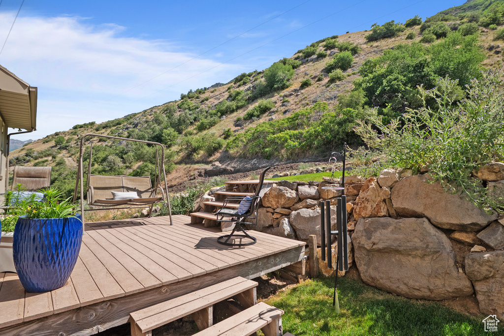 Wooden deck featuring a mountain view