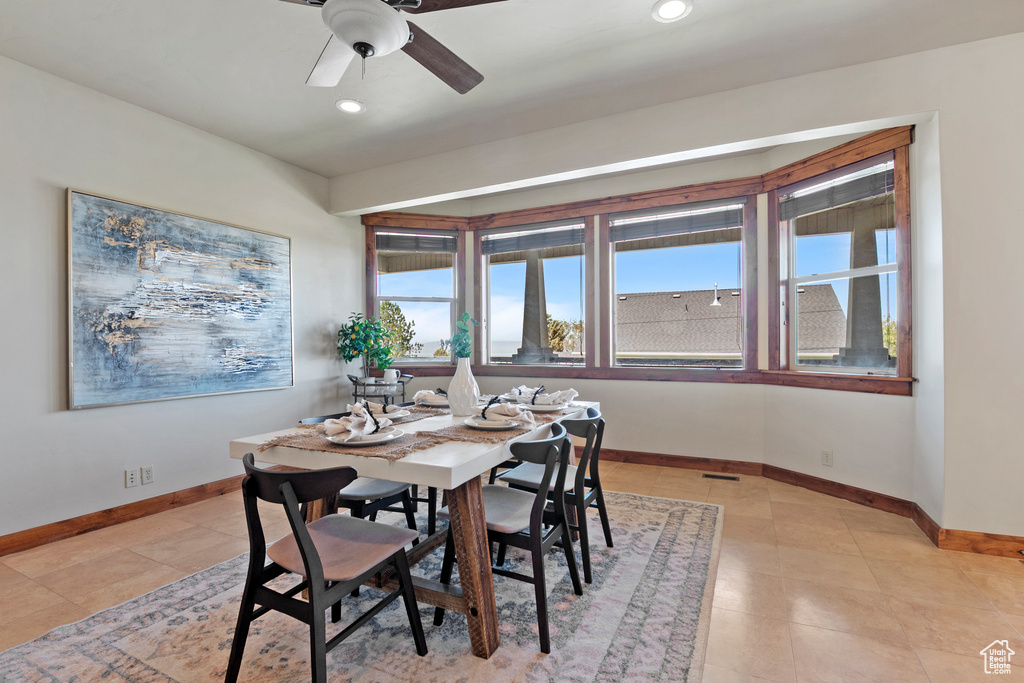 Dining area featuring ceiling fan, recessed lighting, and light tile patterned floors