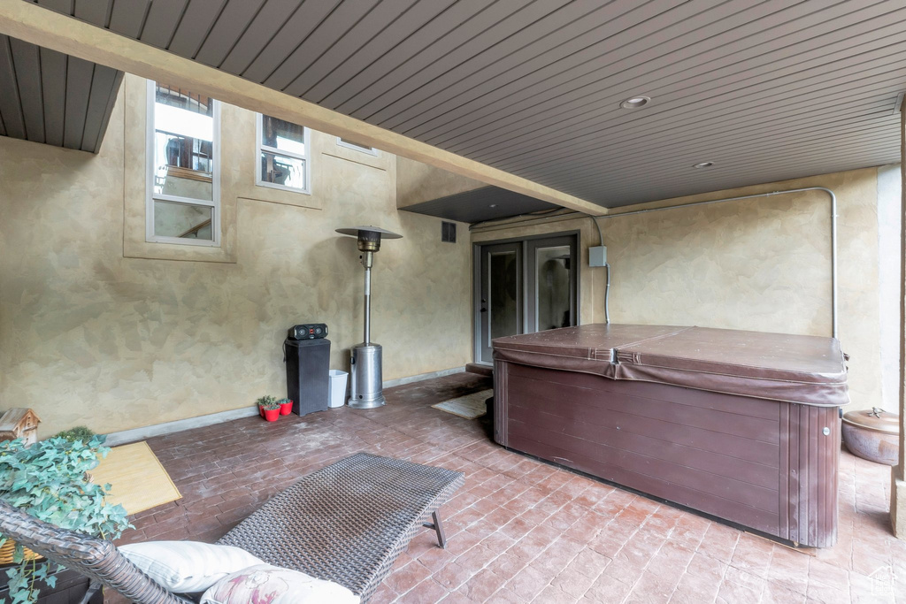 View of patio / terrace with a hot tub
