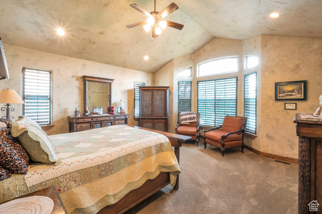Bedroom featuring carpet floors, multiple windows, high vaulted ceiling, recessed lighting, and a ceiling fan